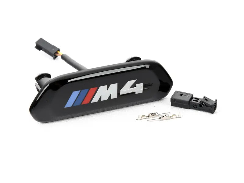 Laden Sie das Bild in Galerie -Viewer, BMW M Blende Lehne M4 Logo schwarz beleuchtet - 52109503039